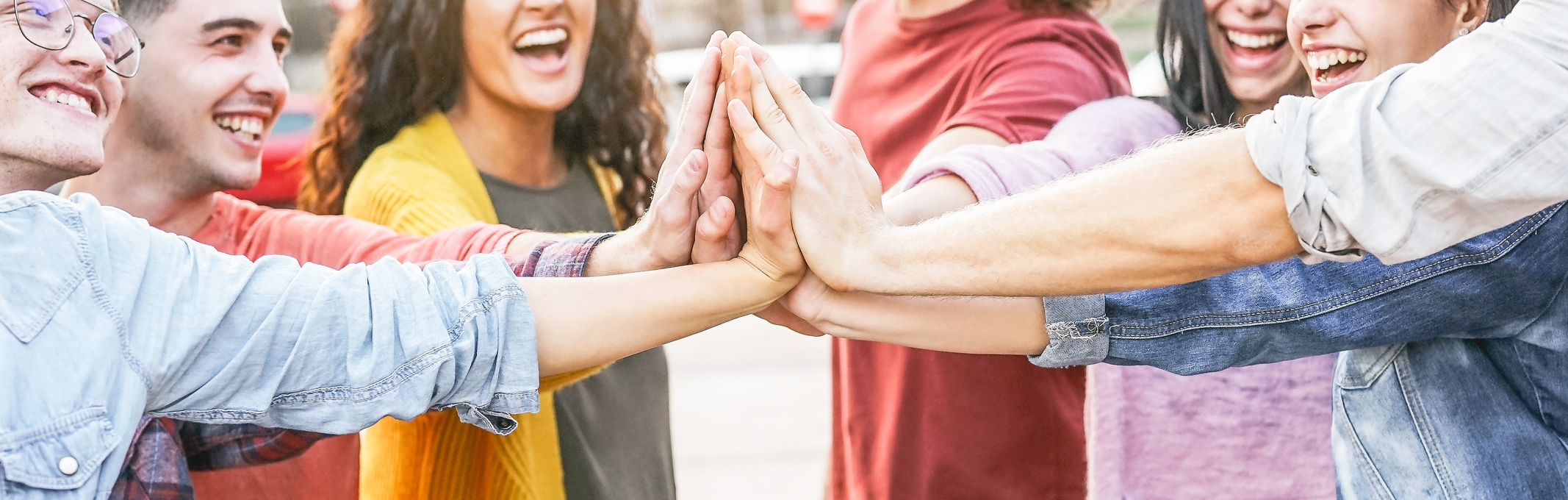 Group of Diverse Friends Stacking Hands 